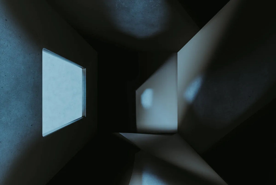 a dark room with a small window in it