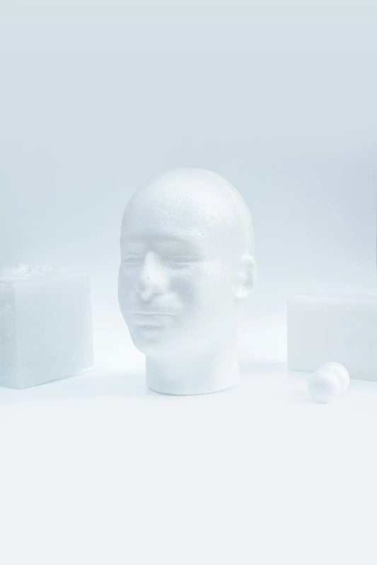 white ceramic head bust on white surface