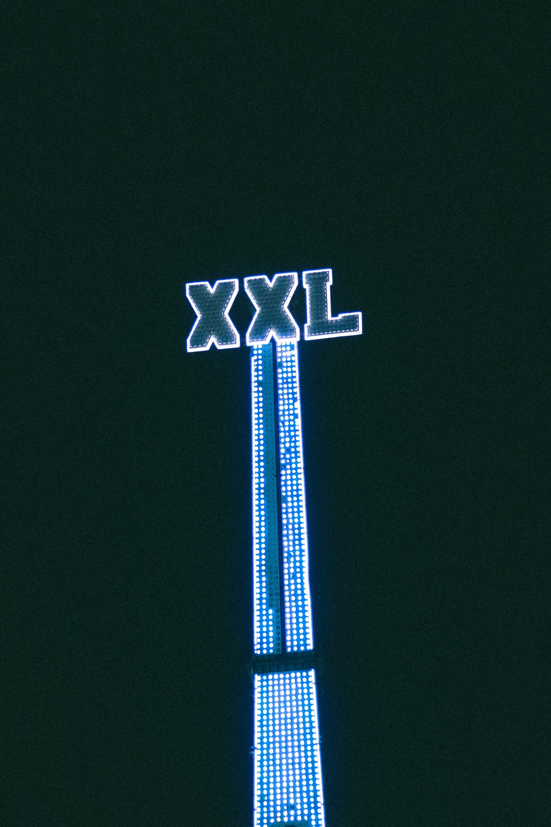 a tall clock tower lit up at night
