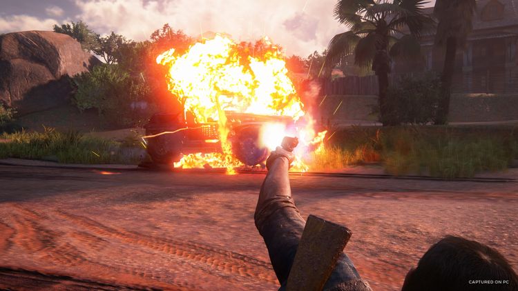 Action scene from Uncharted: Legacy of Thieves Collection featuring an exploding car.